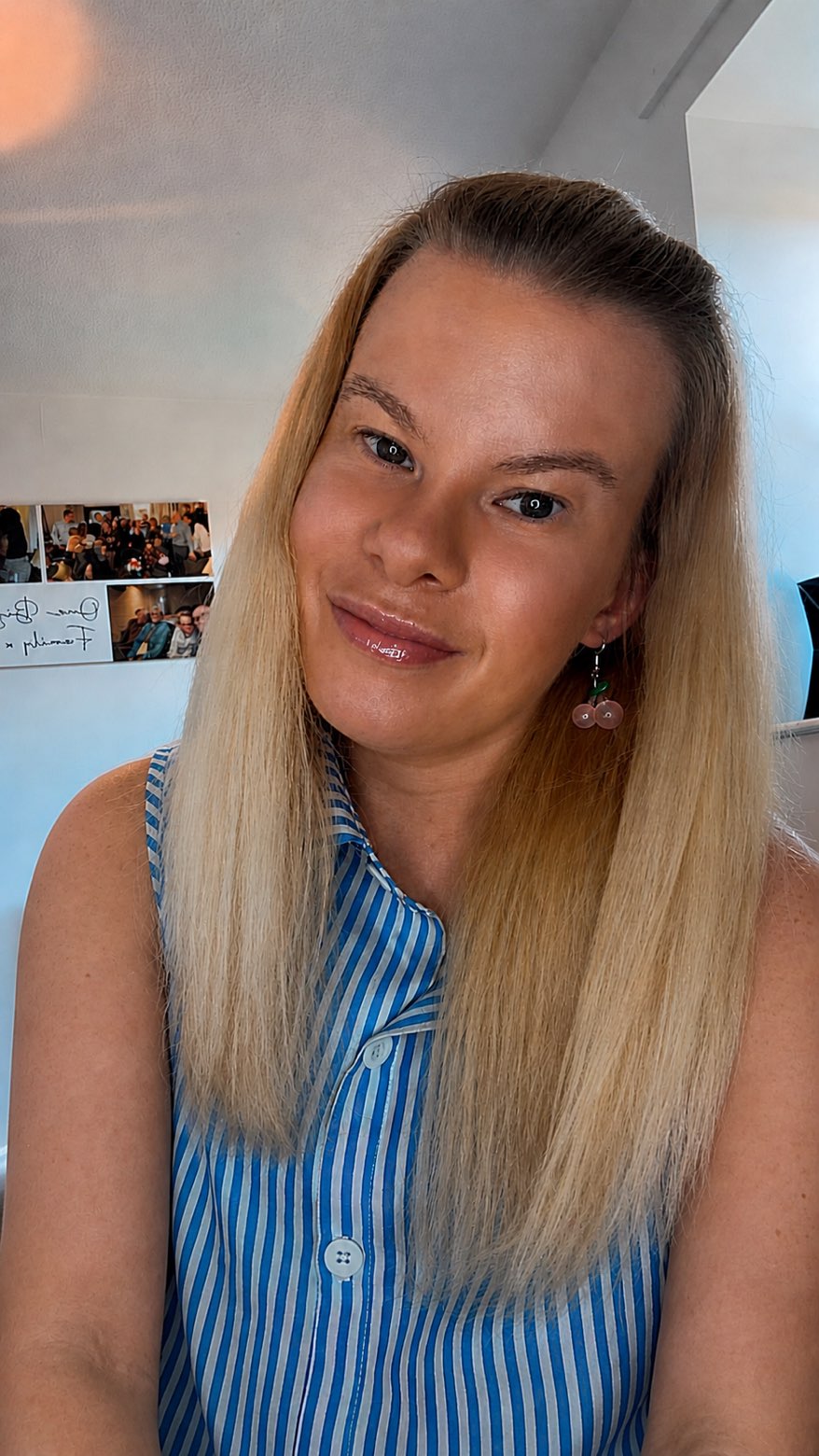 Zoë Castle smiling, wearing cherry earrings